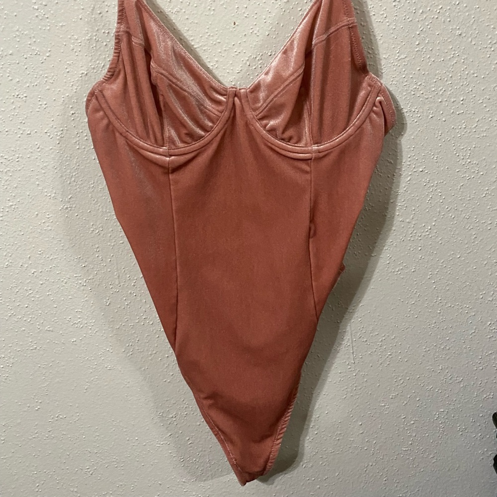Pink Body suit
Size Medium/Large